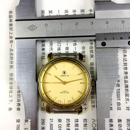 SHANGHAI JINJI 37mm manual mechanical watch with 17 jewels, shock resistance, and gold nail markers on a classic dial.