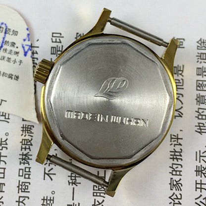 27mm Leidi Steel Lady Watch with golden dial and 18 jewels, paired with matching band for elegant style.