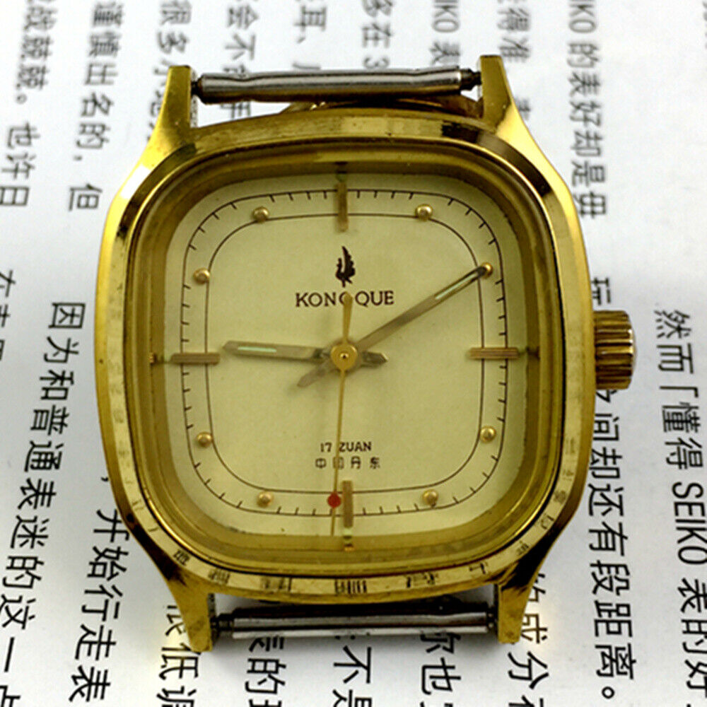 33mm Kongque steel manual mechanical watch with 17 jewels, golden dial, and matching steel band for elegant wear.