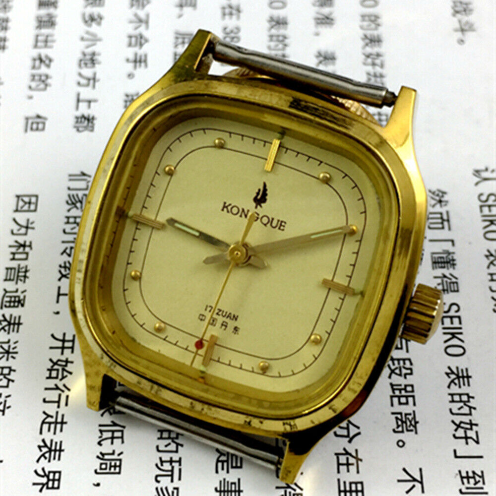 33mm Kongque steel manual mechanical watch with 17 jewels, golden dial, and matching steel band for elegant wear.