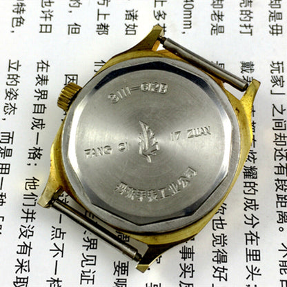 33mm Kongque steel manual watch with 17 jewels, golden dial, and stylish steel band for elegant wear.