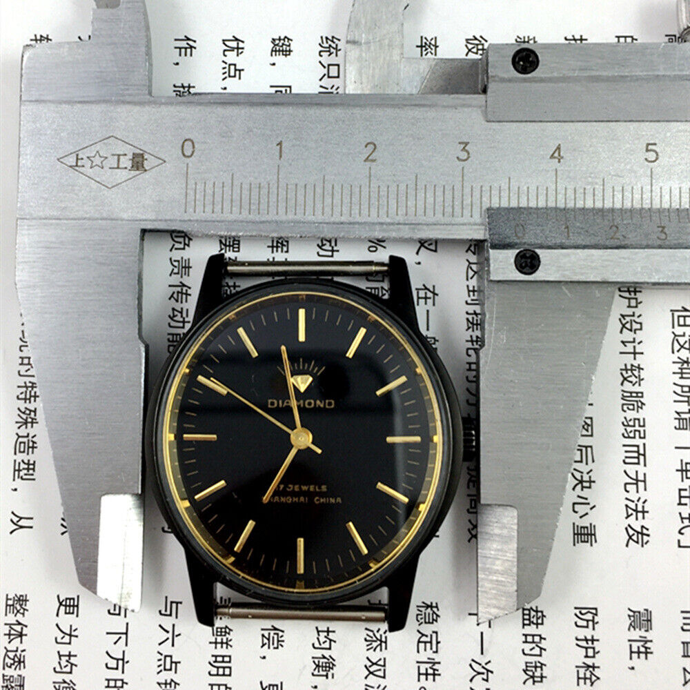 36mm SHANGHAI DIAMOND oval manual watch with 17 jewels, black dial, and sleek black case for refined elegance and precision.