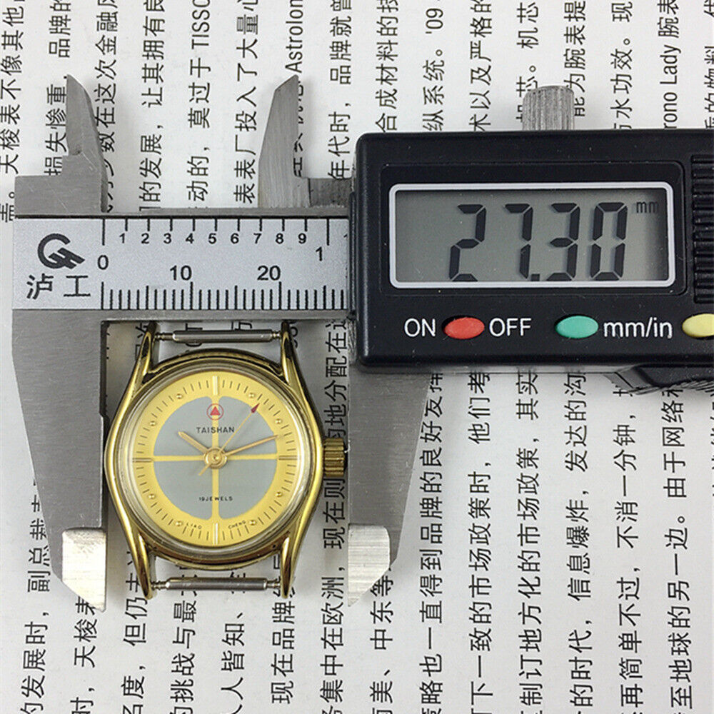 Liaocheng TAISHAN 27mm elegant lady watch with golden markers, 19 jewels, and manual mechanical movement.