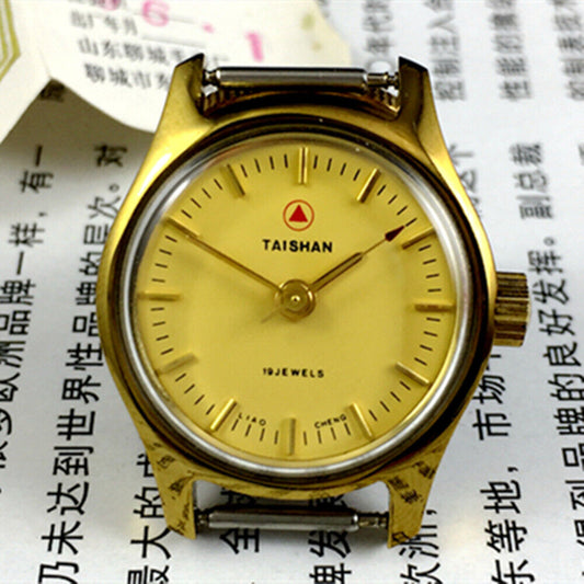 Elegant 26mm TAISHAN lady watch with manual mechanical movement, golden case, and 19 jewels for precise timekeeping.