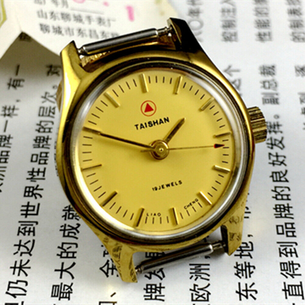 Elegant 26mm TAISHAN lady watch with manual mechanical movement, golden case, and 19 jewels for precise timekeeping.