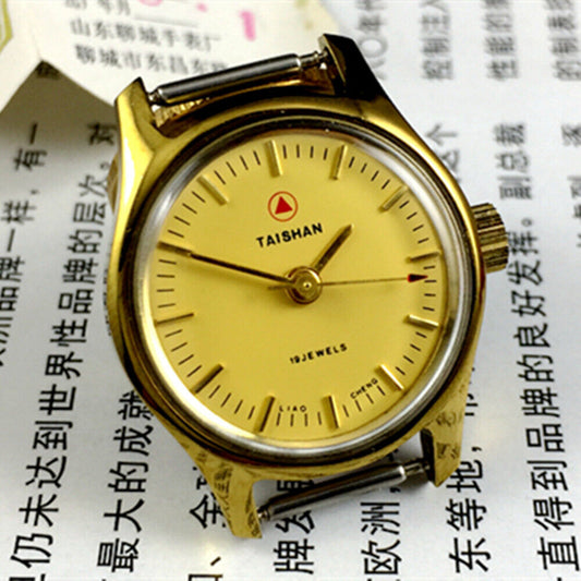 Elegant 26mm TAISHAN lady watch with manual mechanical movement, golden case, and 19 jewels for precise timekeeping.