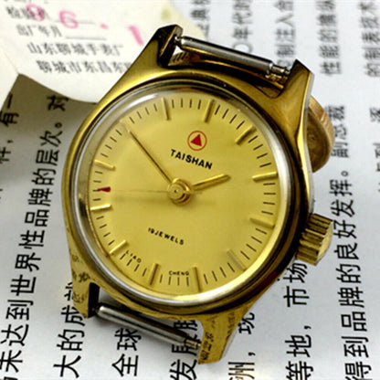 TAISHAN 26mm lady watch with golden case, manual mechanical movement, and 19 jewels for precise timekeeping.