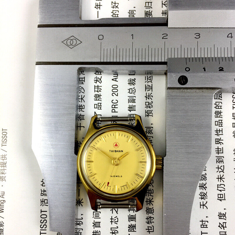 TAISHAN 26mm lady watch with golden case, manual mechanical movement, and 19 jewels for accuracy.