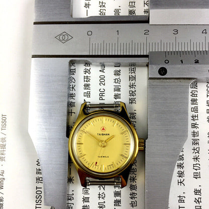TAISHAN 26mm lady watch with golden case, manual mechanical movement, and 19 jewels for accuracy.