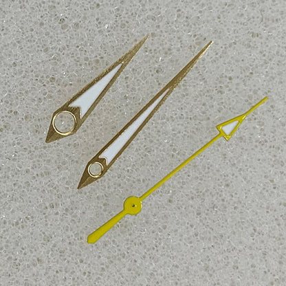 Golden arrow-shaped luminous watch hands with green trim, compatible with NH35/NH36/4R/7S movements.
