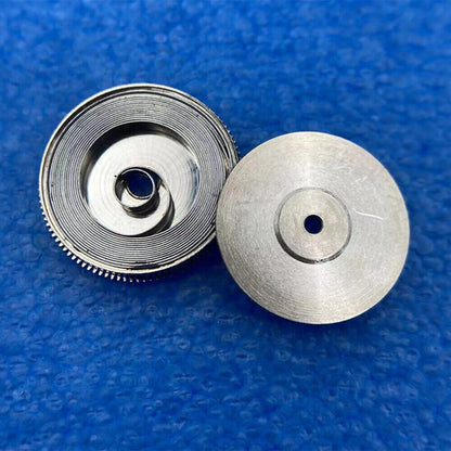 Complete mainspring and barrel for China Made 2824 watch movement, compatible with generic parts, ensuring precise timekeeping.
