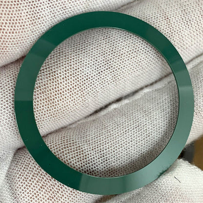 38mm ceramic watch bezel insert with sleek bevel design, no carved font, compatible with various watch parts.