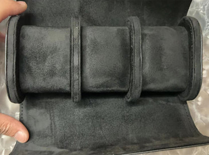 Black leather travel watch case with 3 slots, portable organizer for safe watch storage.