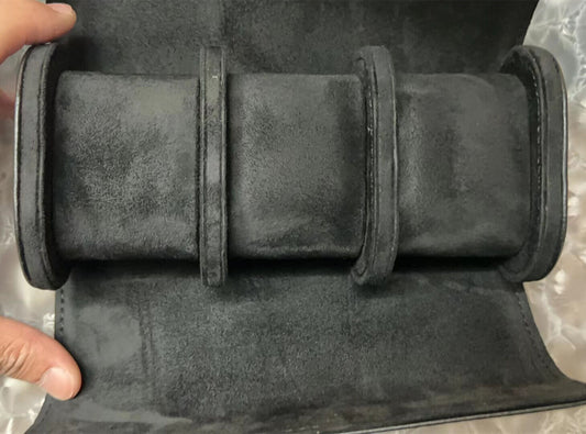 Black leather travel watch case with 3 slots, portable organizer for safe watch storage.