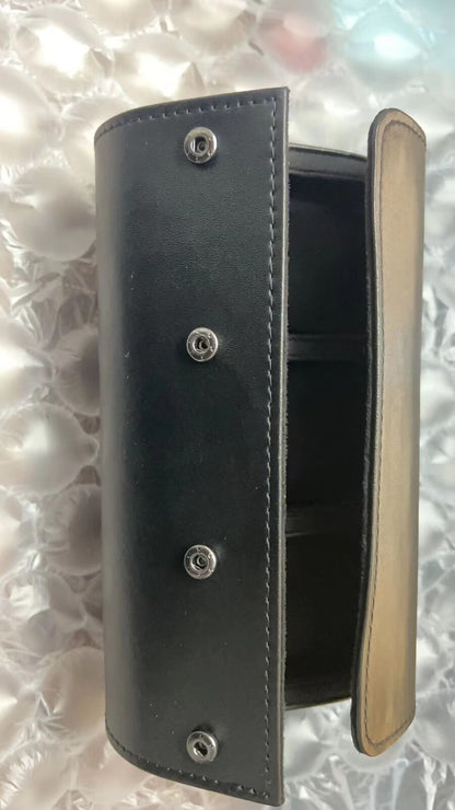 Black leather travel watch case with 3 slots, portable organizer for secure watch storage on the go.