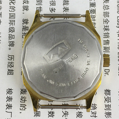 Octagonal golden dial manual mechanical watch by Tianjin Factory, classic design for elegant style.
