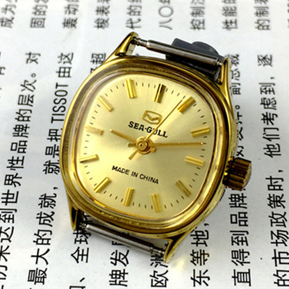 Golden dial Seagull ladies watch with nail hour markers, manual mechanical movement, elegant Tianjin brand design.