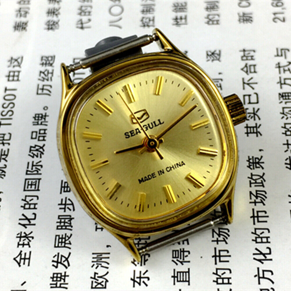 Golden dial Seagull ladies watch with nail hour markers and manual mechanical movement by Tianjin brand.