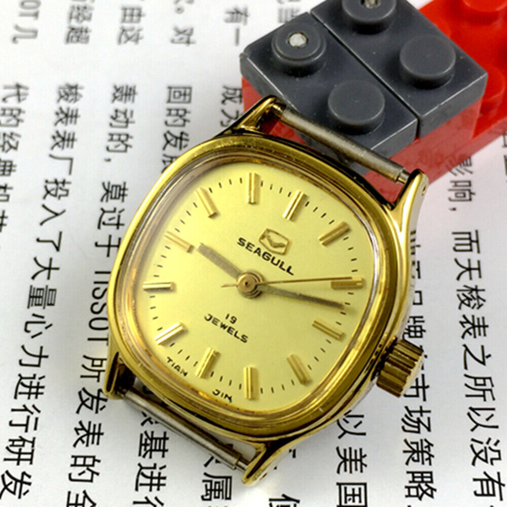 Golden dial Seagull manual mechanical ladies watch with 19 jewels, crafted in Tianjin, China for elegant timekeeping.