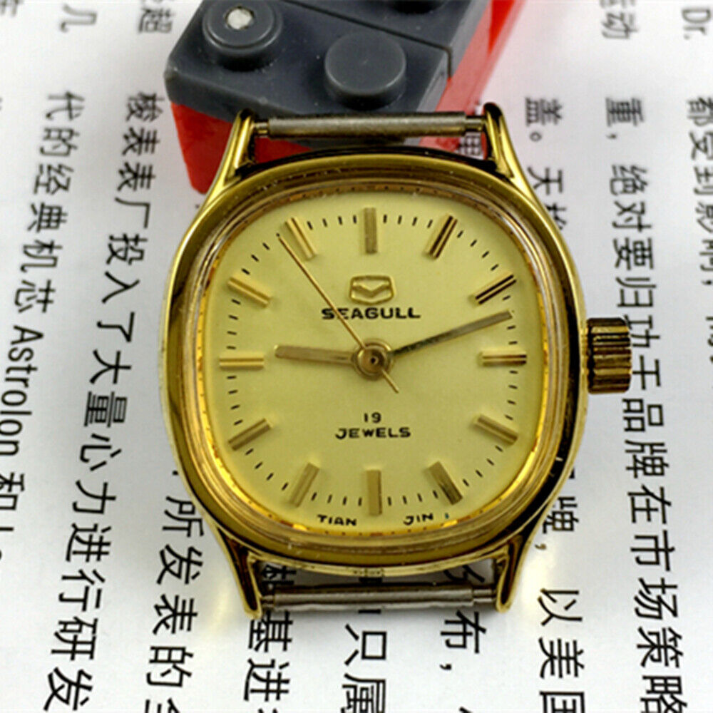 Golden dial Seagull manual mechanical ladies watch with 19 jewels, crafted in Tianjin, China for elegant timekeeping.