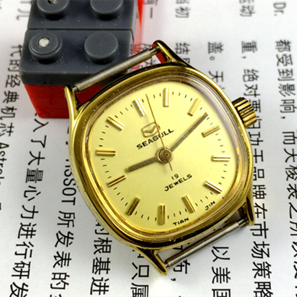 Golden dial Seagull ladies watch with 19 jewels, manual mechanical movement, crafted in Tianjin for elegant style.