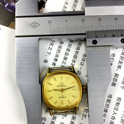 Golden dial Seagull ladies watch with 19 jewels, manual mechanical movement crafted in Tianjin, China.