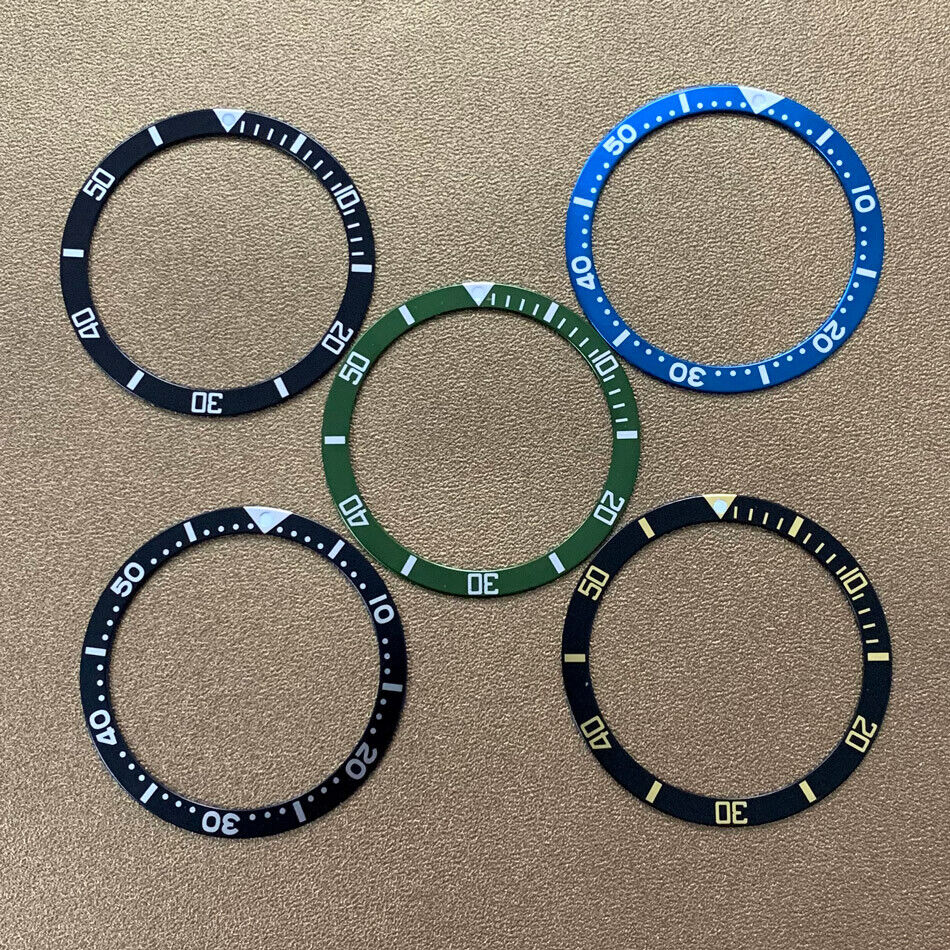 39mm green, blue, and black aluminum bezel inserts for watch repair and customization.