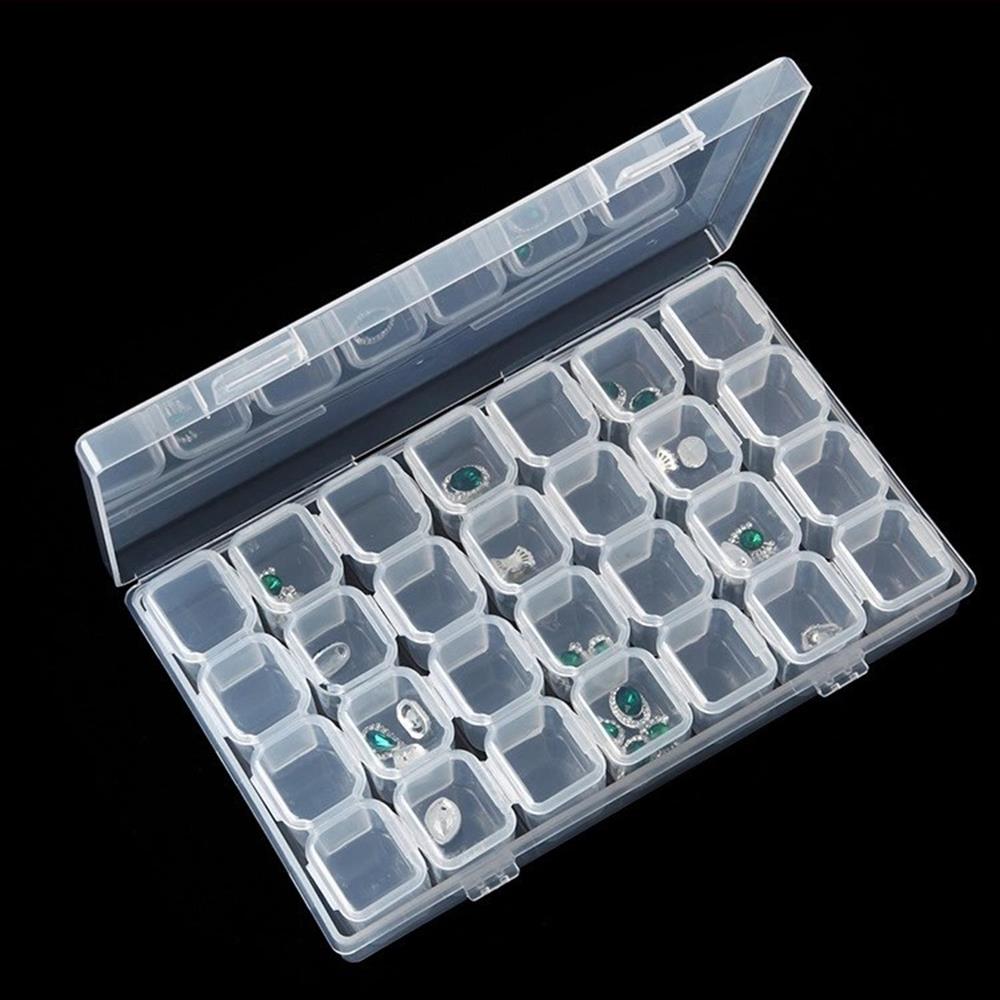 Clear 28-grid 11x17cm mini toolbox organizing small watch accessory parts efficiently.