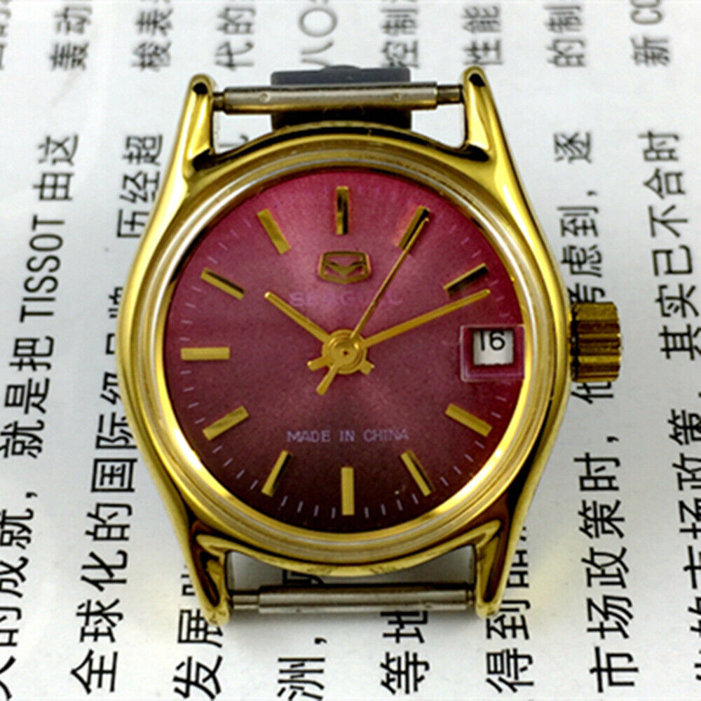 Purple dial ladies watch by Tianjin Seagull, golden nail markers, manual mechanical movement, elegant style.