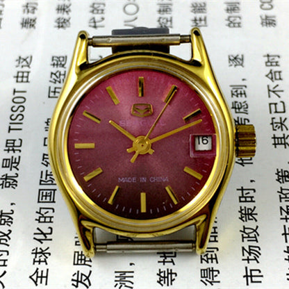 Purple dial ladies watch by Tianjin Seagull, golden nail markers, manual mechanical movement, elegant style.