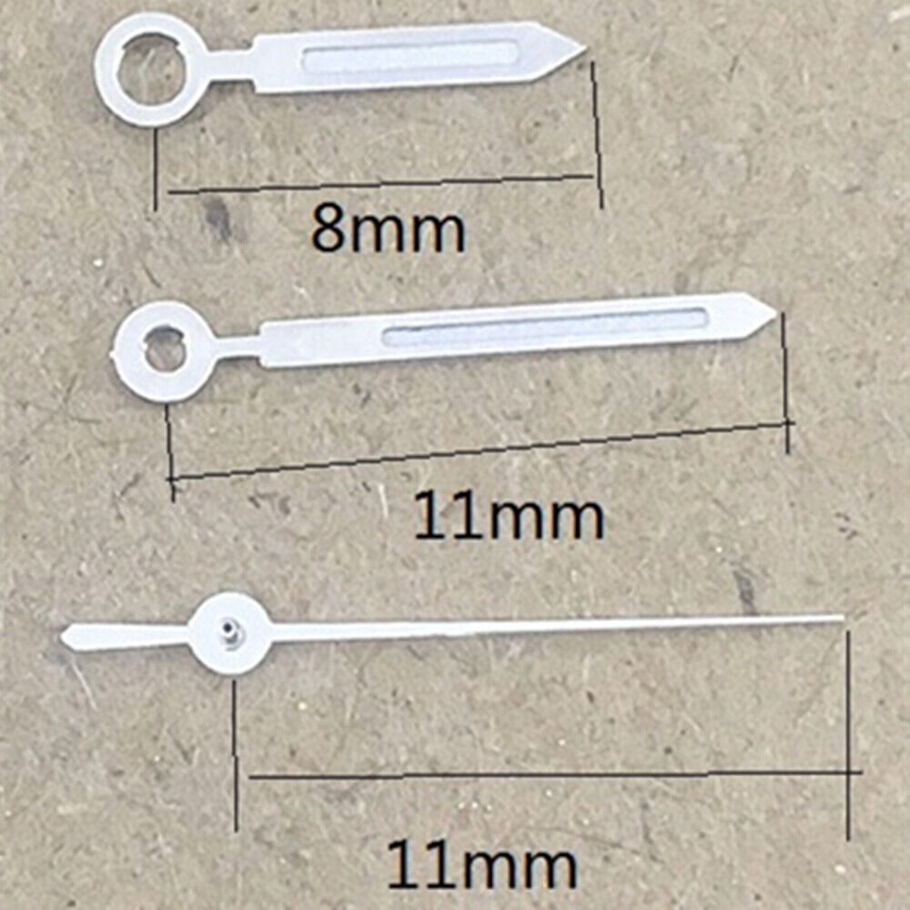 Arrow-shaped green lume watch hands with silver trim, designed for Miyota 1M12 quartz movement.