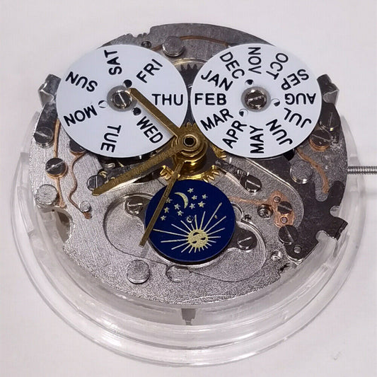 Automatic mechanical watch with silver dial, week/month display at 12, moon phase at 6, brand name included.