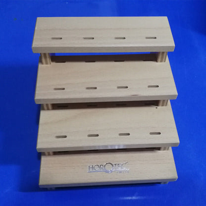 Horotec MSA12.398 wooden storage rack holding 12 tweezers, organizing watch repair tools efficiently.