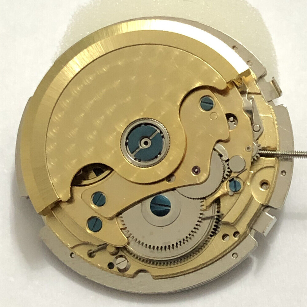 Silver 3 Hands Asian Mingzhu JHB08 mechanical watch movement, date at 6, small seconds at 3 and 9, precision-crafted by Mingzhu.
