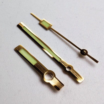 Golden trim green luminous watch hands for NH35A/NH36A movement, enhancing visibility and precision.