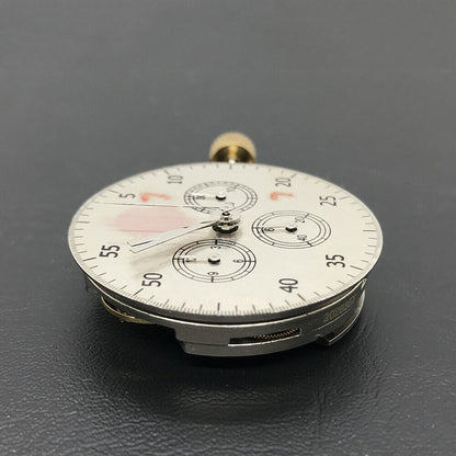Close-up of Asian 7750 automatic chronograph movement with ETA 7753 layout featuring subdials at 3, 6, and 9 o'clock positions.