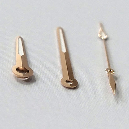 Green luminous rose gold watch hands set by B10, compatible with NH35A/NH36A/4R36 movements for precise timekeeping.