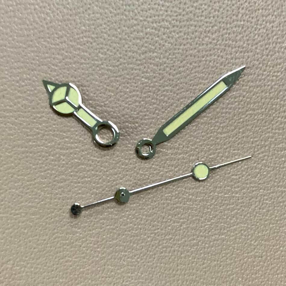 Green luminous orange watch hands set for NH35A/NH36A movement, ensuring precise timekeeping.