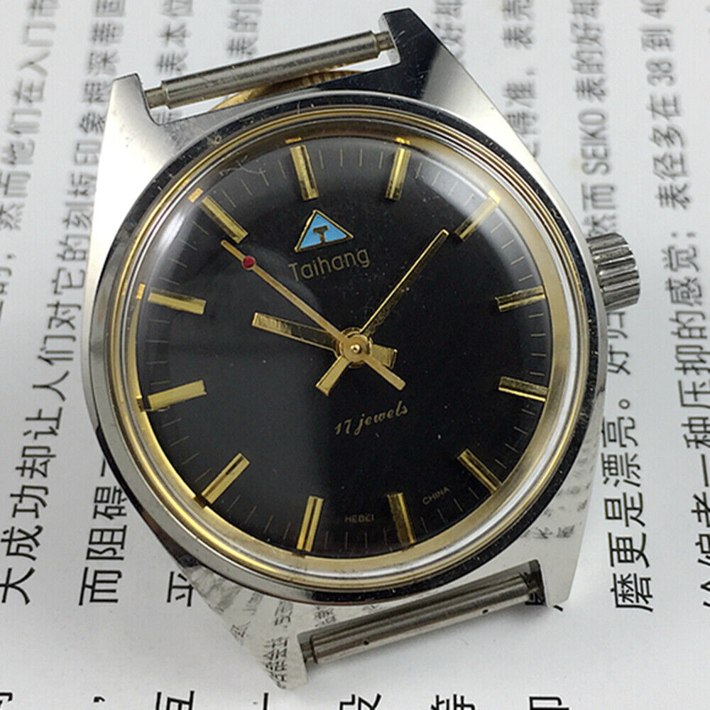 Black dial 32mm Taihang manual mechanical watch with gold markers, 17 jewels for accurate timekeeping.