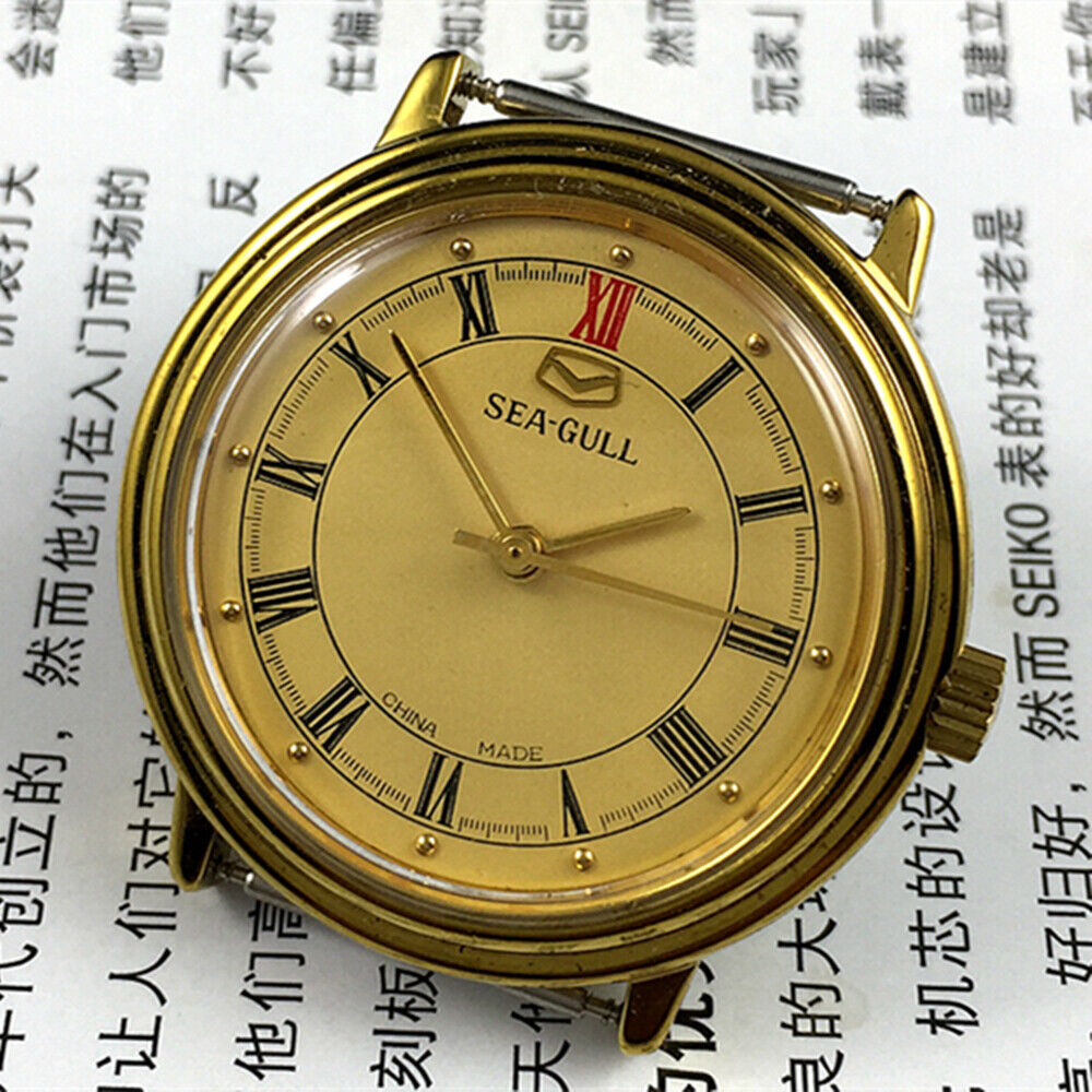 Tianjin Seagull 35mm watch with gold round case, manual mechanical movement, elegant dial design for classic style
