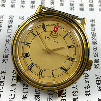 Tianjin Seagull 35mm watch with gold round case, manual mechanical movement, elegant dial design for classic style