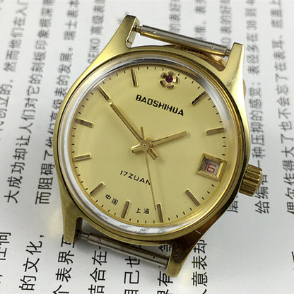 Yellow dial 33mm manual mechanical watch with single calendar and 17-jewel shock-resistant movement.