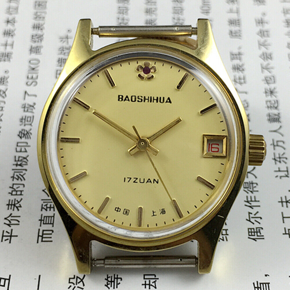 Yellow dial 33mm manual mechanical watch with single calendar and 17 jewels, shock-resistant design.