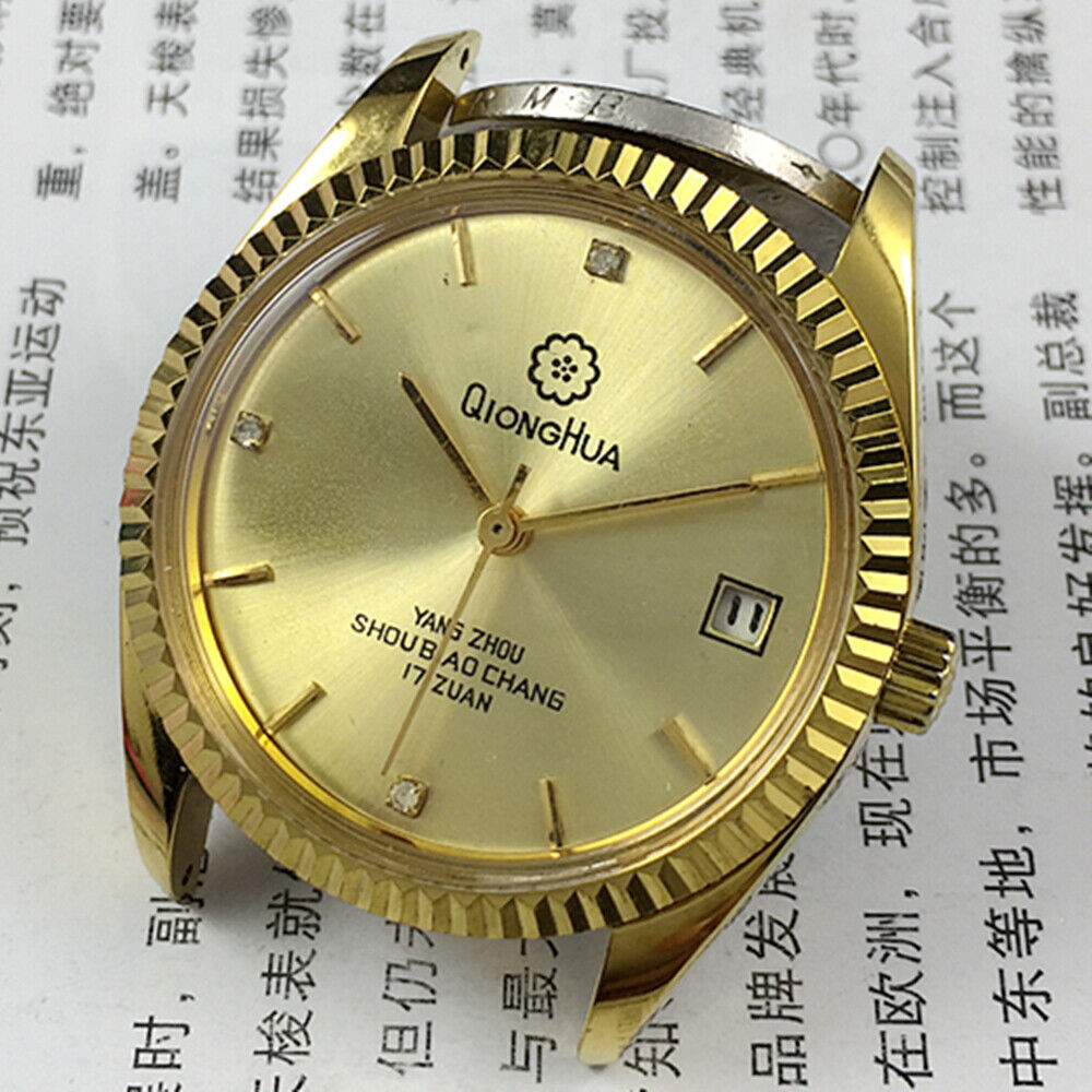 Chinese Qionghua men?s manual mechanical watch with 17 jewels, golden dial, and single calendar display.