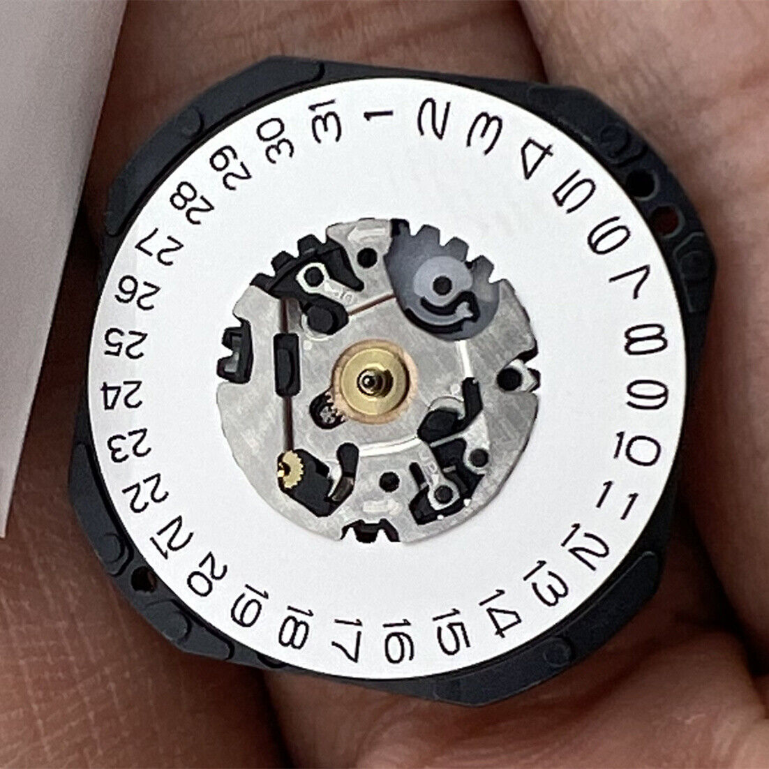 Hattori Epson VX32 Quartz watch movement with date at 3, precision Japan-made component.
