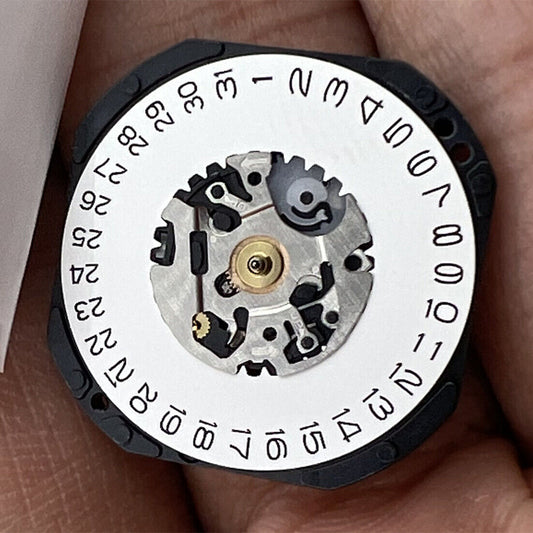 Hattori Epson VX32 Quartz watch movement with date at 3, precision Japan-made component.
