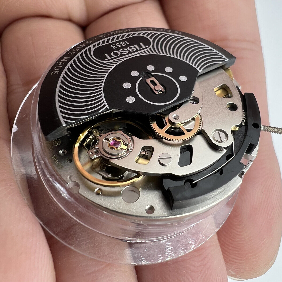 Swiss Made ETA C01.211 chronograph movement with white dial, precision watch part by Tissot 1853.