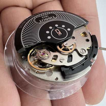 Swiss Made ETA C01.211 chronograph movement with white dial, precision watch part by Tissot 1853.