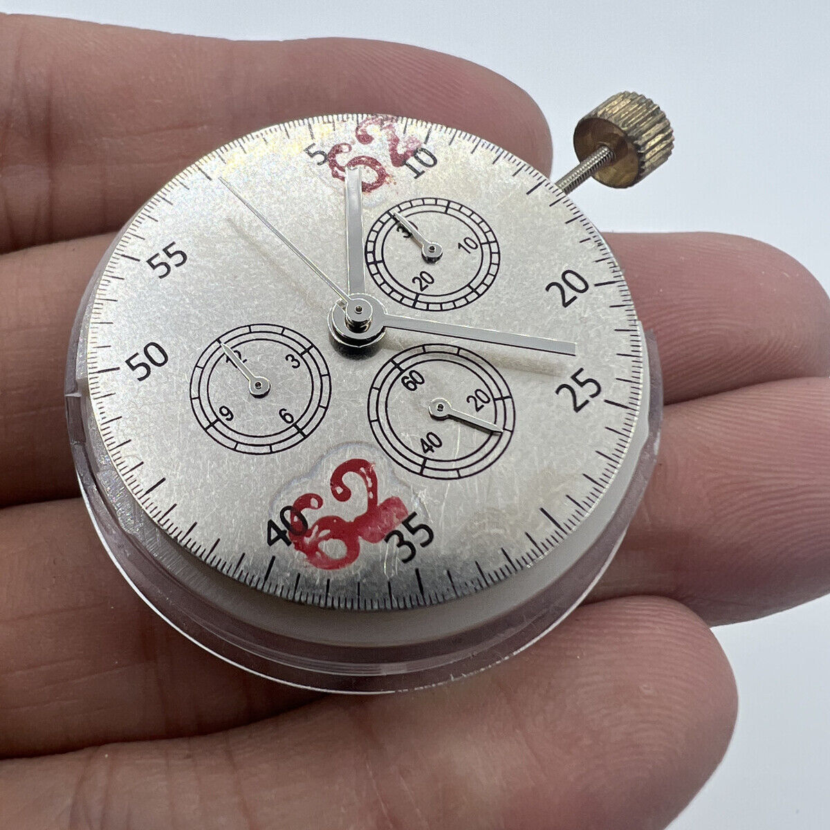 Asian 7750 automatic chronograph movement with ETA 7753 configuration showing detailed watch mechanism at 3, 6, and 9 o'clock positions.