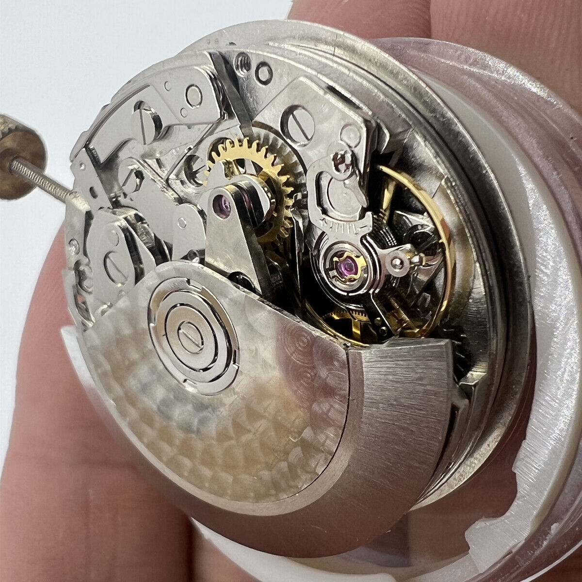 Detailed Asian 7750 automatic chronograph movement with ETA 7753 layout highlighting subdials at 3, 6, and 9 o'clock.